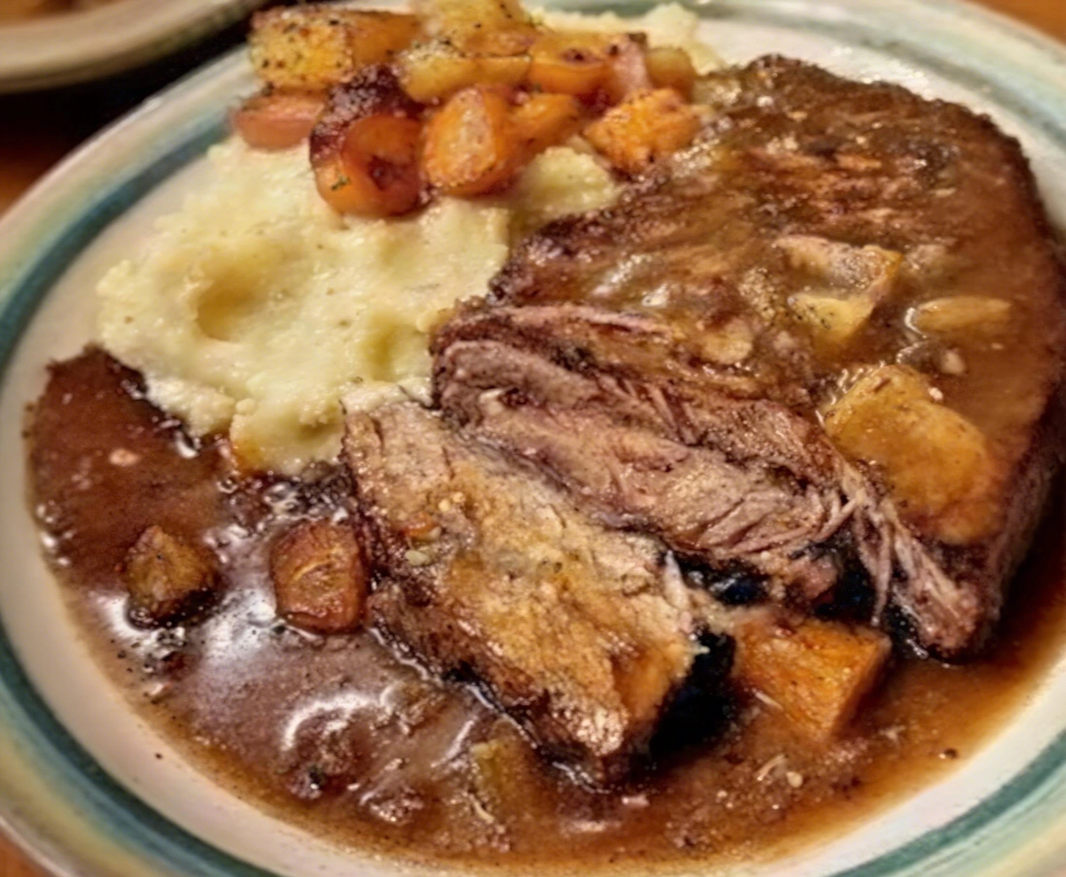 Thumbnail for Slow-Cooked Pot Roast with Gravy Over Creamy Mashed Potatoes
