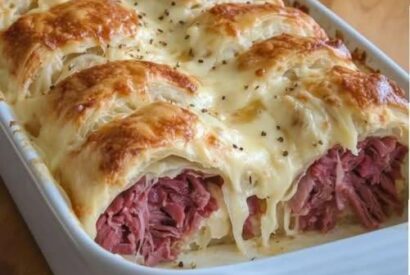 Thumbnail for Crescent Roll Reuben BakeSavory, melty, and irresistibly easy