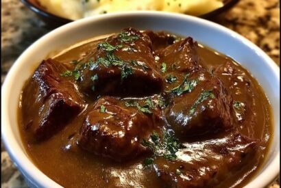 Thumbnail for Slow-Cooked Beef Tips with Rich Onion Gravy
